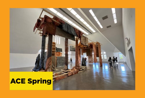 a sculptural installation, architectural elements draped in earth tone fabrics, evocative of a deconstructed home, dare I say, apocalyptic?