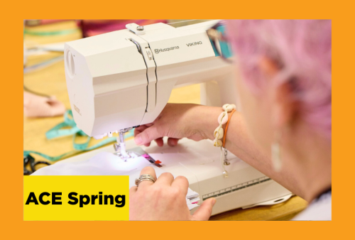 a kooky lady with pink hair feeds her fabric through a sewing machine at the school of the art institute of chicago