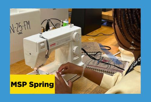 a young girl feeds fabric from her clothing design through a sewing machine