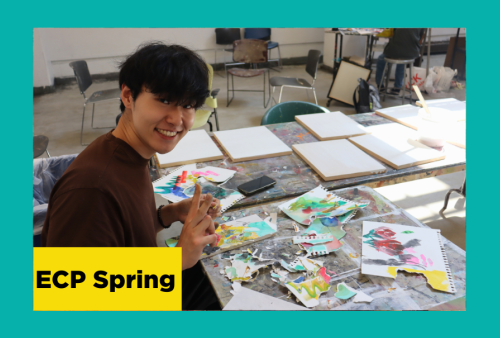 a TA at the school of the art institute of chicago flashes a peace sign as he works to assemble a watercolor collage
