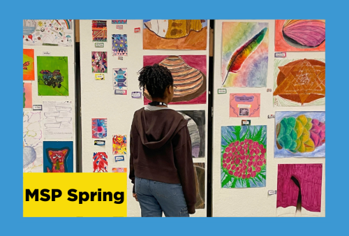 a young girl admires a gallery wall that is chock full of colorful drawings created by she and her classmates at the school of the art institute of chicago