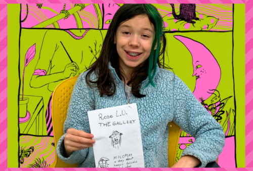 A young girl with a teal streak in her hair holds up her comic. Molly Colleen Occonnell's work is behind her