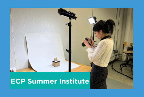 a student photographs their work against a white backdrop with three point lighting