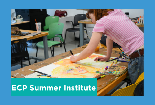 a students stands over her painting in concentration