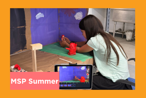 a young student poses her figures to capture for her stop motion animation project