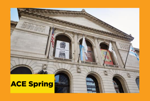 Looking up at the front facade of an art museum, with flags hanging down