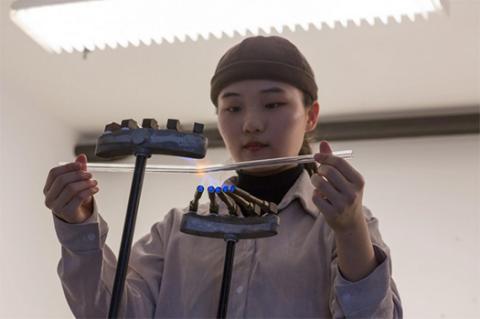 Woman bending glass