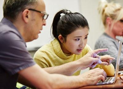 People in front of computer