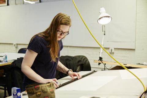 Woman at drafting table