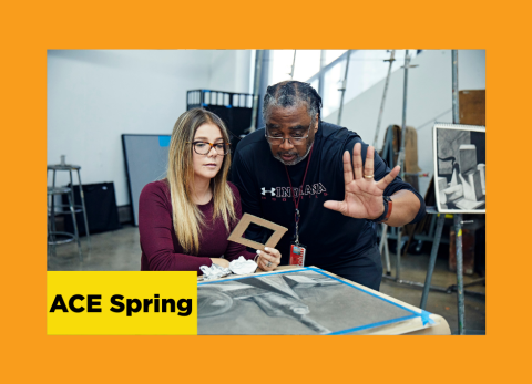 a teacher at the school of the art institute speaks with his hands as he instructs a student in the fundamentals of drawing