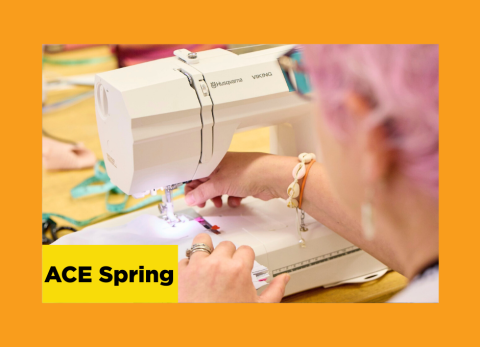 a kooky lady with pink hair feeds her fabric through a sewing machine at the school of the art institute of chicago