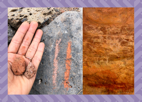 A hand holds two pigment rocks against the marks they make on a stone, a closeup of a mineral rock face