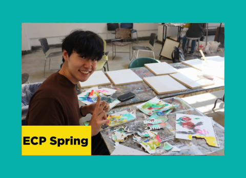 a TA at the school of the art institute of chicago flashes a peace sign as he works to assemble a watercolor collage