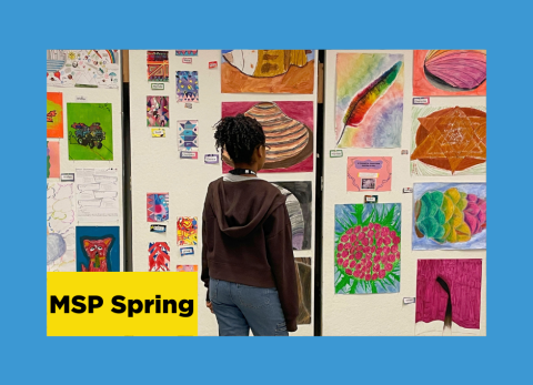 a young girl admires a gallery wall that is chock full of colorful drawings created by she and her classmates at the school of the art institute of chicago