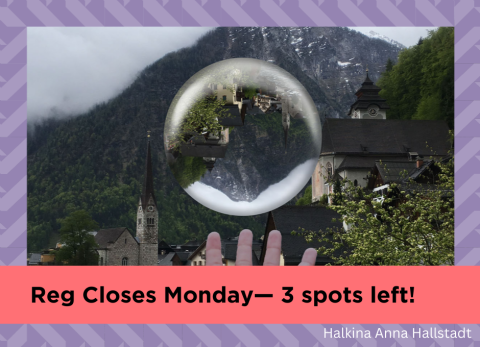a bubble hovers above a hand with a European mountain village in the background