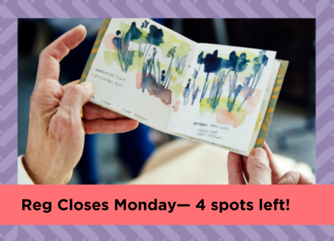 hands hold up a chapbook with watercolors of flowers inside