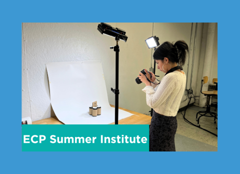 a student photographs their work against a white backdrop with three point lighting