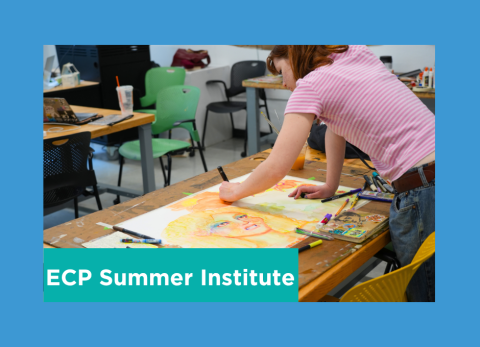 a students stands over her painting in concentration