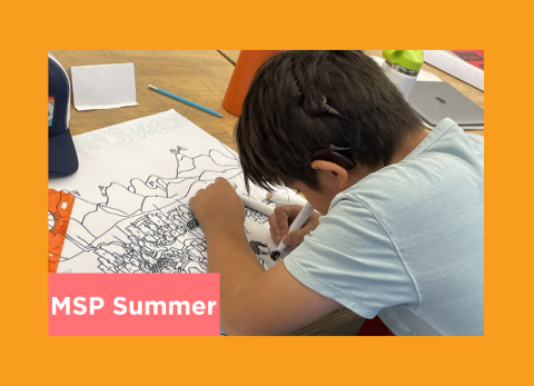 a young student is deep in concentration as he inks a comic of his dream