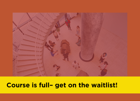 an overhead view of students looking at artwork near a staircase