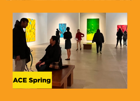 People standing inside an art gallery looking at art